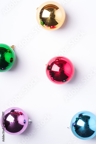 Fototapeta Naklejka Na Ścianę i Meble -  Christmas New Year composition. Gifts, colorful ball decorations on white background. Winter holidays concept. Flat lay, top view