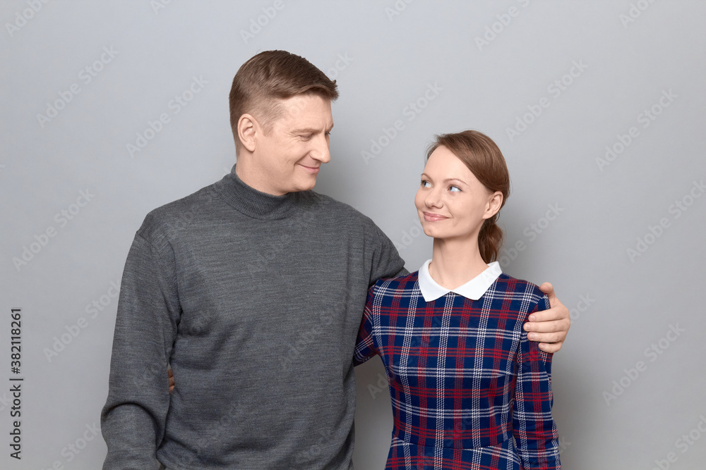 Portrait of happy man and woman hugging and looking at each other Portrait of happy man and woman hugging and looking at each other