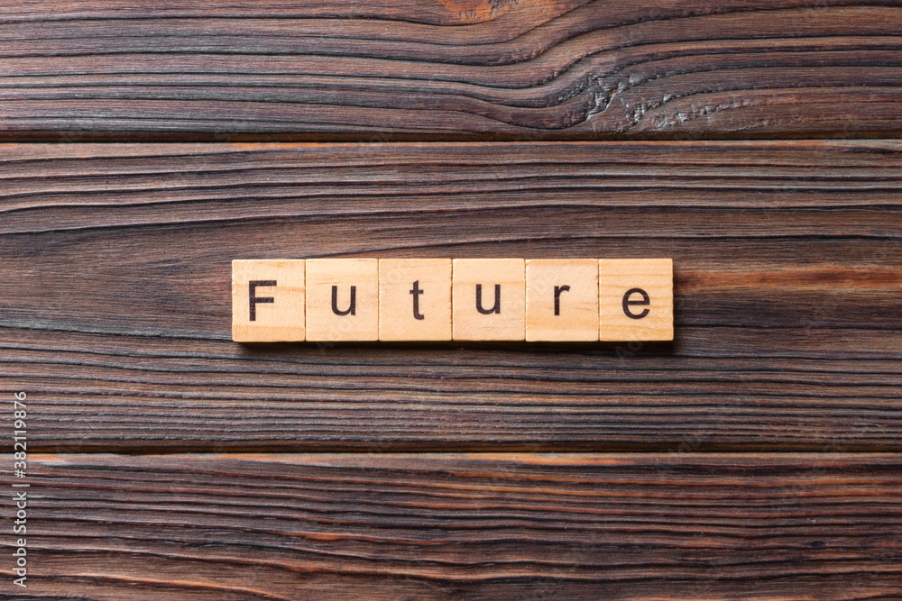 Future word written on wood block. Future text on wooden table for your desing, concept