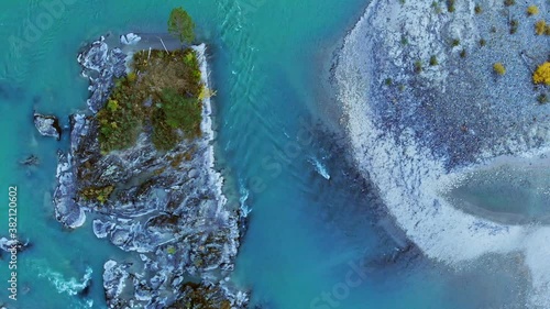 Aerial view of the drone on the serpentine road, autumn forest, mountains and turquoise river. Altay. Russia photo