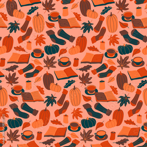 Autumn hygge seamless pattern. Fall print with books, candles, warm socks, cups of coffee, tea, cacao, pumpkins, oak, maple, birch leaves. Cozy home atmosphere. Flat cartoon vector illustration