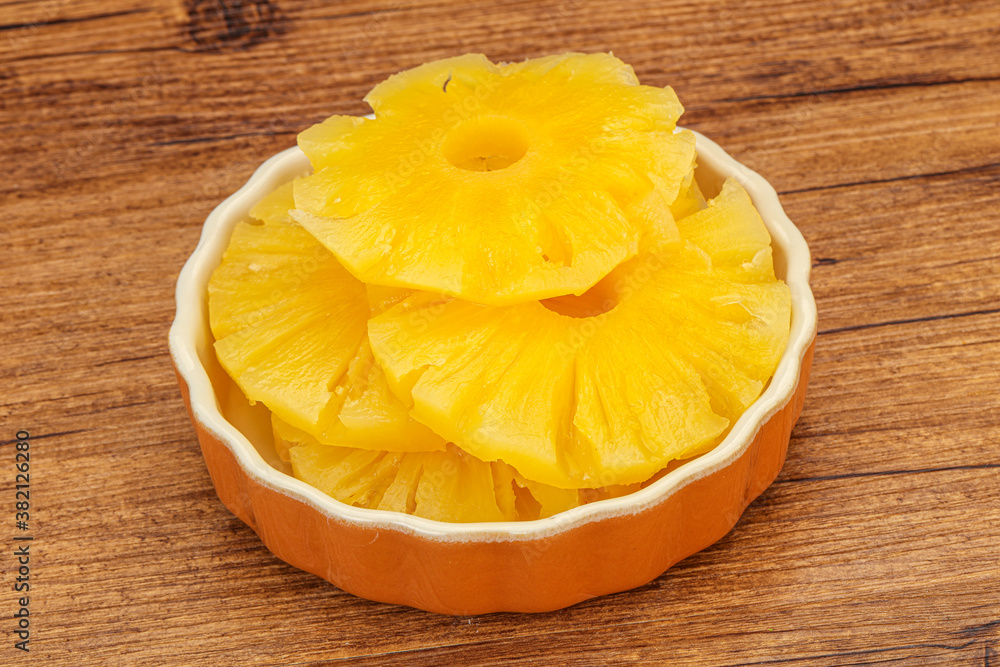 Marinated pineapple rings in the bowl Marinated pineapple rings in the bowl