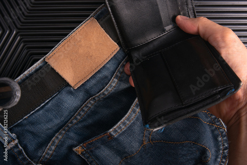 Man pick black wallet from back pocket