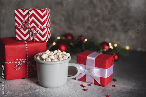 Mugs with hot drink and gingerbread cookie.