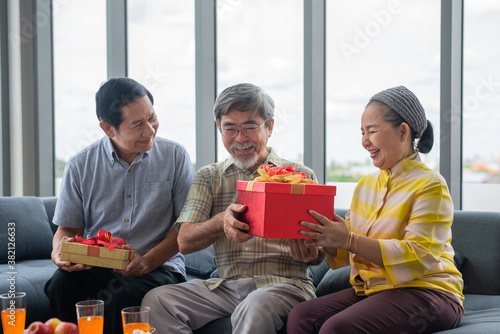 Retired friend recieving present with happiness photo
