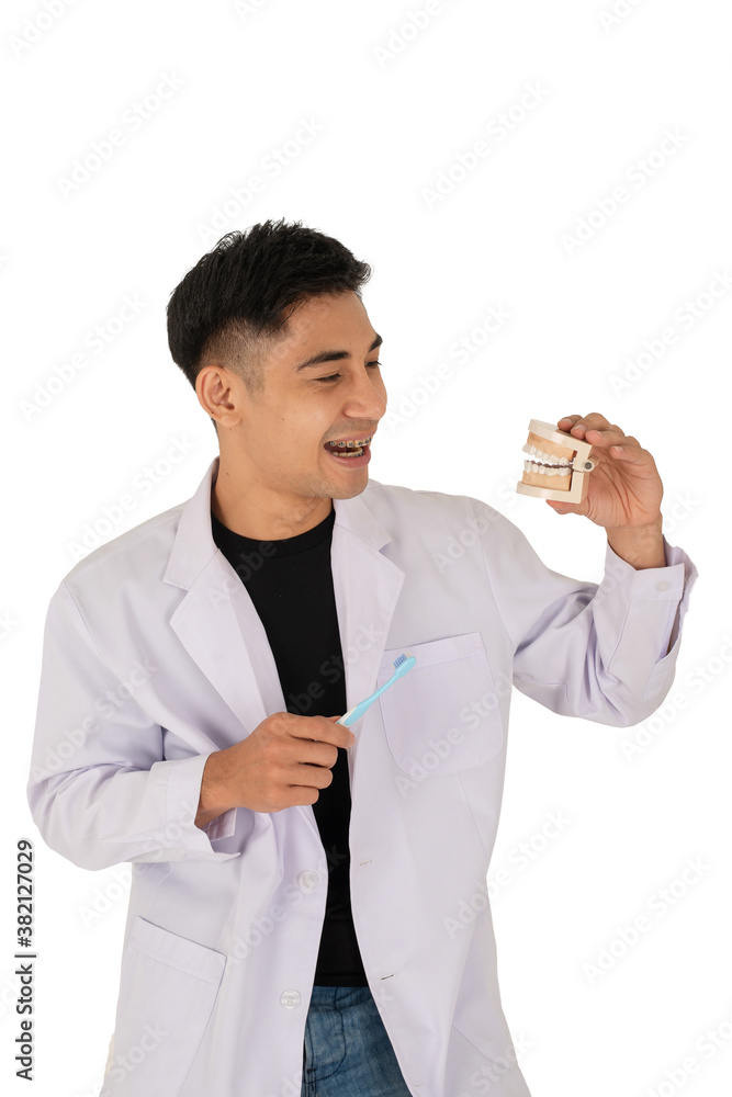 Young man with dental braces talking with denture Young man with dental braces talking with denture