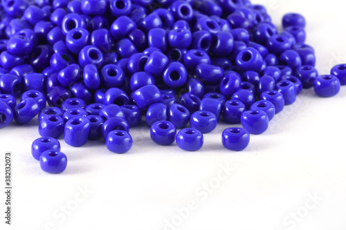 Close up of blue Beads on the white background. Background or texture of beads. macro,It is used in finishing fashion clothes. make bead necklace or string of beads for woman of fashion.