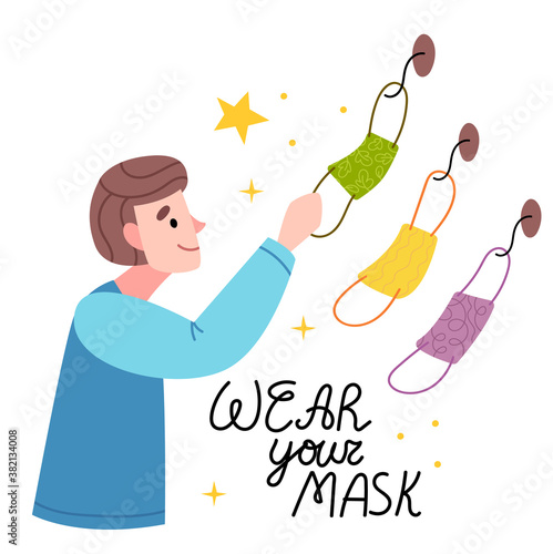 The boy chooses which mask to wear.Choose the mask you need. Coronavirus, COVID-19, flu, disease.