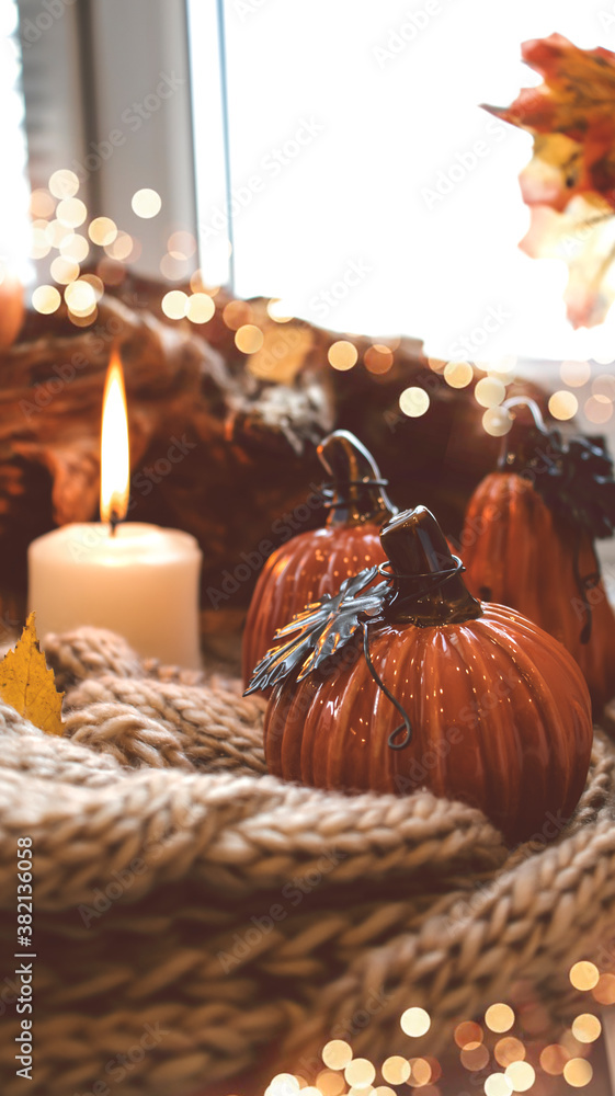 Autumn background with dry leaves, blue cup of coffee. Knitted background, pumpkins, October, November. Autumnal atmosphere. Autumn season. Autumn background with dry leaves, blue cup of coffee. Knitted background, pumpkins, October, November. Autumnal atmosphere. Autumn season.