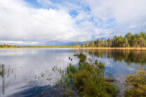 Lake in the Arkhangelsk region, northern Russia. Cloudy autumn weather
