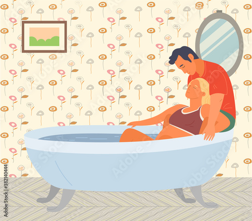 Pregnant woman preparing for childbirth in bathtub. Husband helps his wife. Motherhood, birth of child. Tube with water, colorful wallpaper, mirror. Woman with big belly is in pain. Give birth at home
