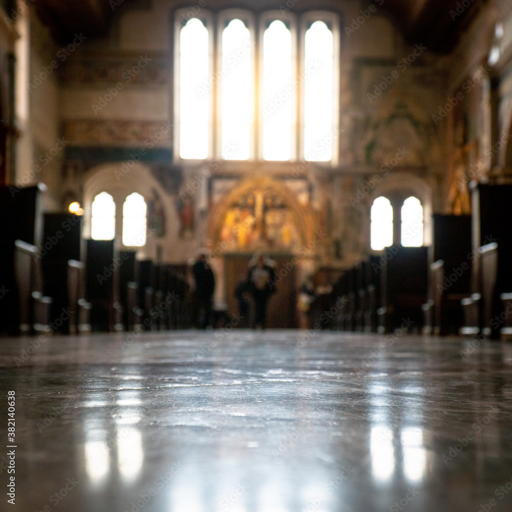 Blurred architecture background of church interior inside old cathedral catholic holy pray god jesus religion with candles Blurred architecture background of church interior inside old cathedral catholic holy pray god jesus religion with candles