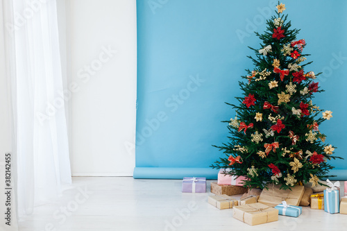 Christmas tree pine with gifts for the new year interior postcard banner background
