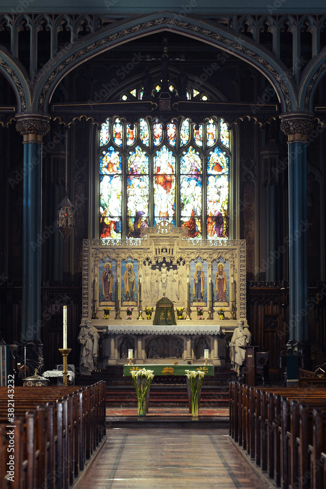 Fototapeta premium Row of empty wooden seats in the house of god, Church indoors