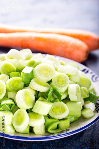 Fresh raw leek slice in a bowl. Washed sliced ready-to-cook leeks.