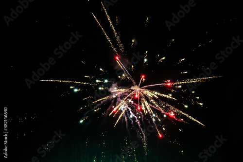 Glowing firecrackers in the sky at New Years Eve