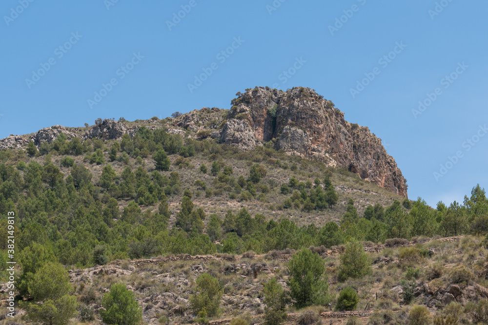 Rocky mountain with trees and bushes in southern Spain