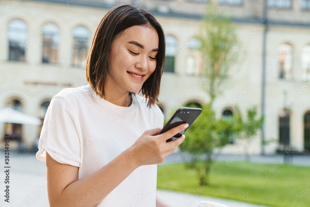Young beautiful asian woman using phone Young beautiful asian woman using phone