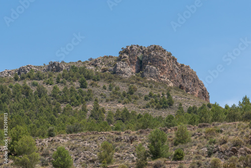 Rocky mountain with trees and bushes in southern Spain