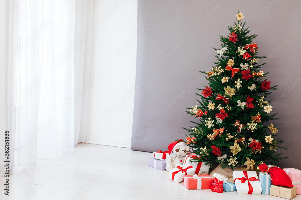 Christmas tree pine with gifts for the new year postcard white gray background decor