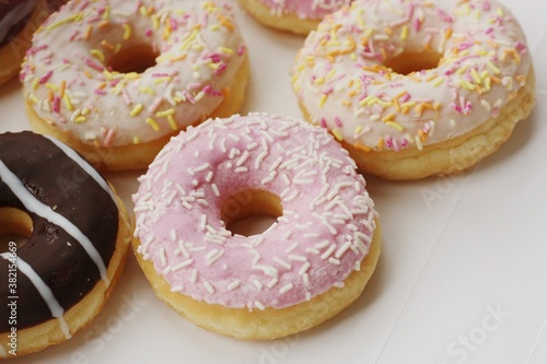 Fresh doughnuts with cream and chocolate macro