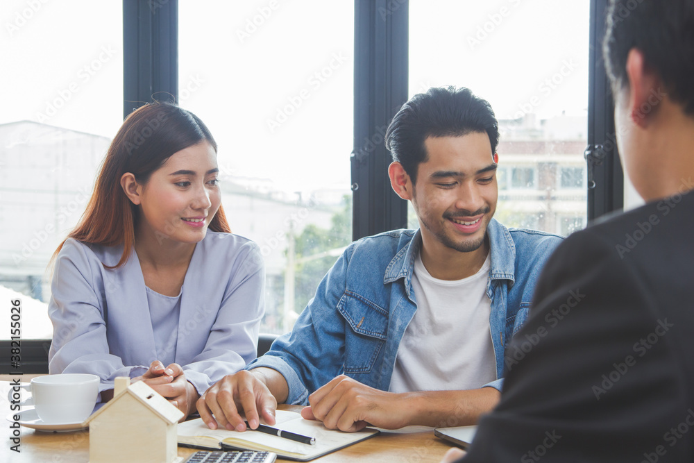 new house / home moving and relocation concept. Happy asian couple talking with apartment landlord from real estate agent / realtor. new house / home moving and relocation concept. Happy asian couple talking with apartment landlord from real estate agent / realtor.