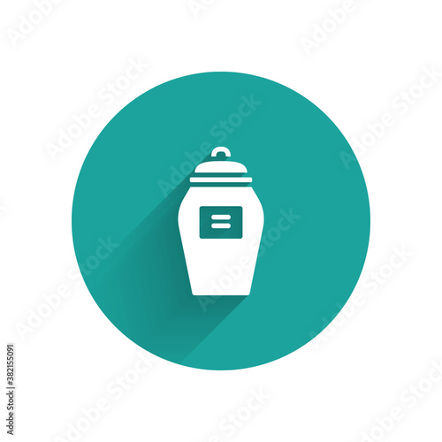 White Funeral urn icon isolated with long shadow. Cremation and burial containers, columbarium vases, jars and pots with ashes. Green circle button. Vector.