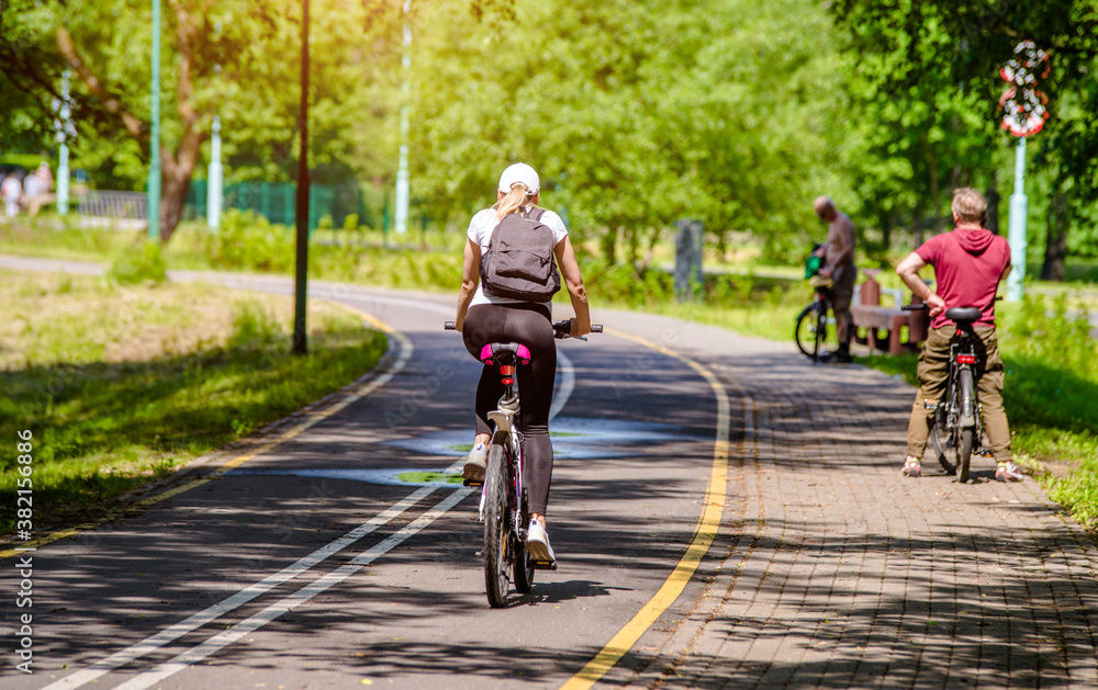 Fototapeta premium Cyclist ride on the bike path in the city Park 