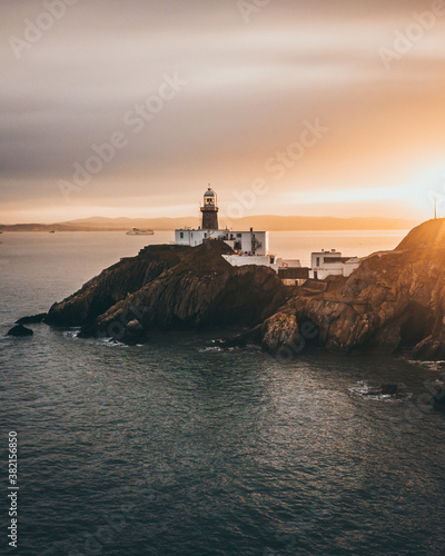 Photography Aerial View of Howth lighthouse during sunset .