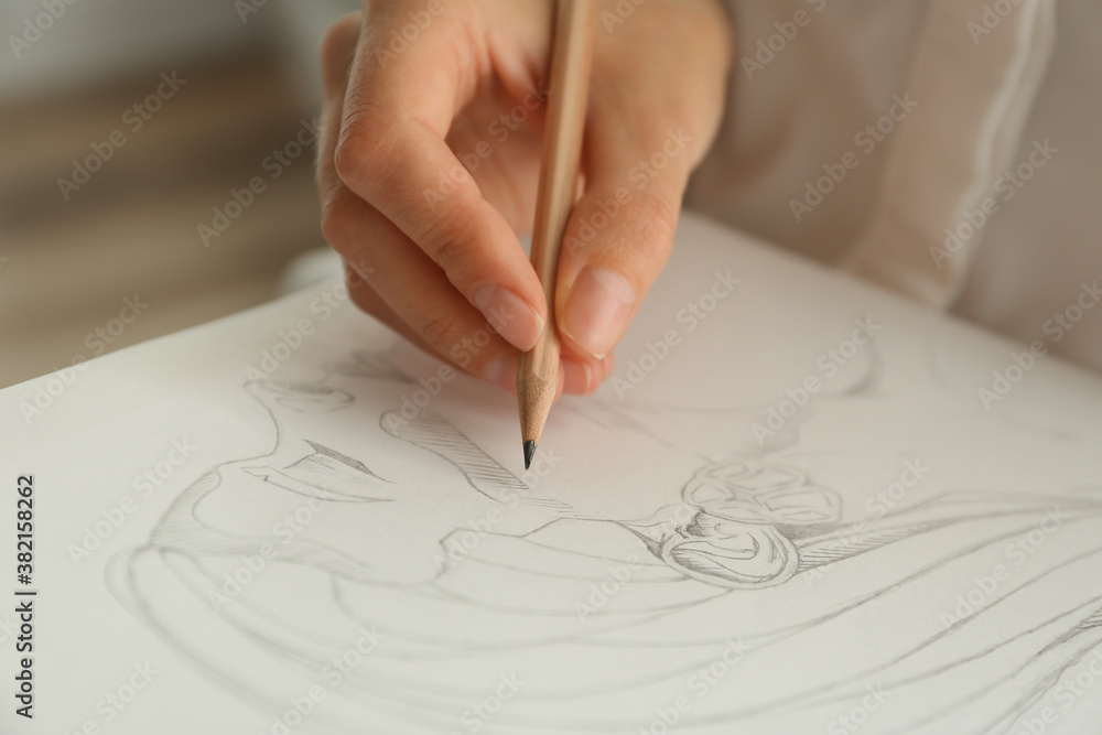 Φωτογραφία Woman drawing girl's portrait with pencil on sheet of paper, closeup