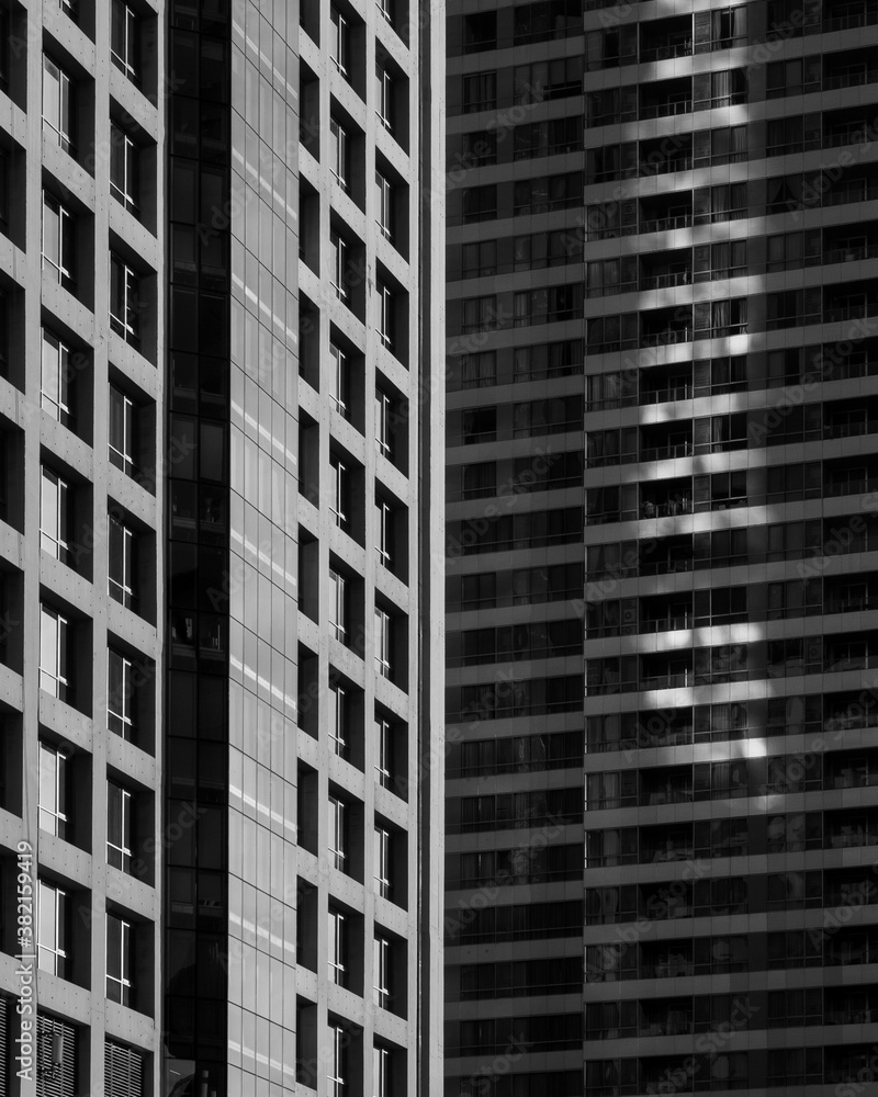 Abstract Glass Facade of high-rise building Modern Architecture look illusion in black and white color Abstract Glass Facade of high-rise building Modern Architecture look illusion in black and white color