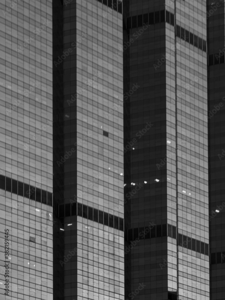 Abstract Glass Facade of high-rise building Modern Architecture look illusion in black and white color