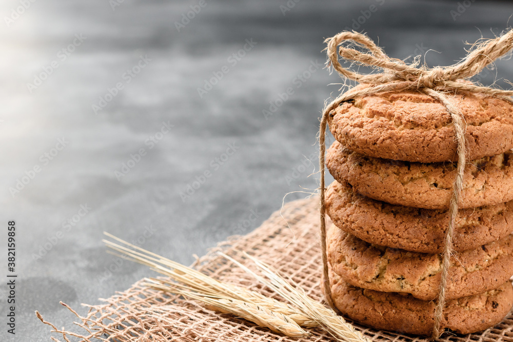 Homemade oatmeal cookies with raisins on a dark background Homemade oatmeal cookies with raisins on a dark background