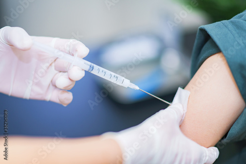 corona virus vaccine injection to young woman