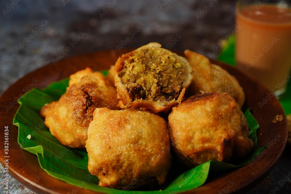 Sukhiyan - Kerala deep fried tea time snack with green gram filling, selective focus Sukhiyan - Kerala deep fried tea time snack with green gram filling, selective focus