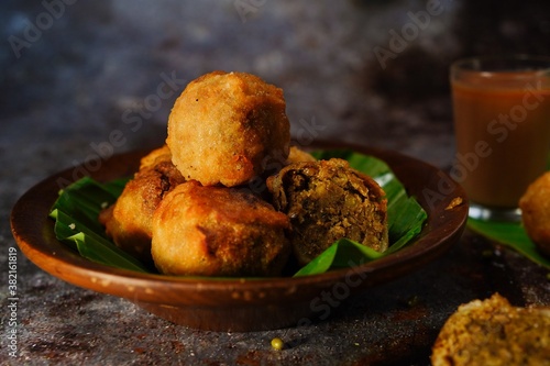 Sukhiyan - Kerala deep fried tea time snack with green gram filling, selective focus photo