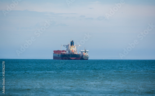 Seascape with fishing vessel on the roadstead.