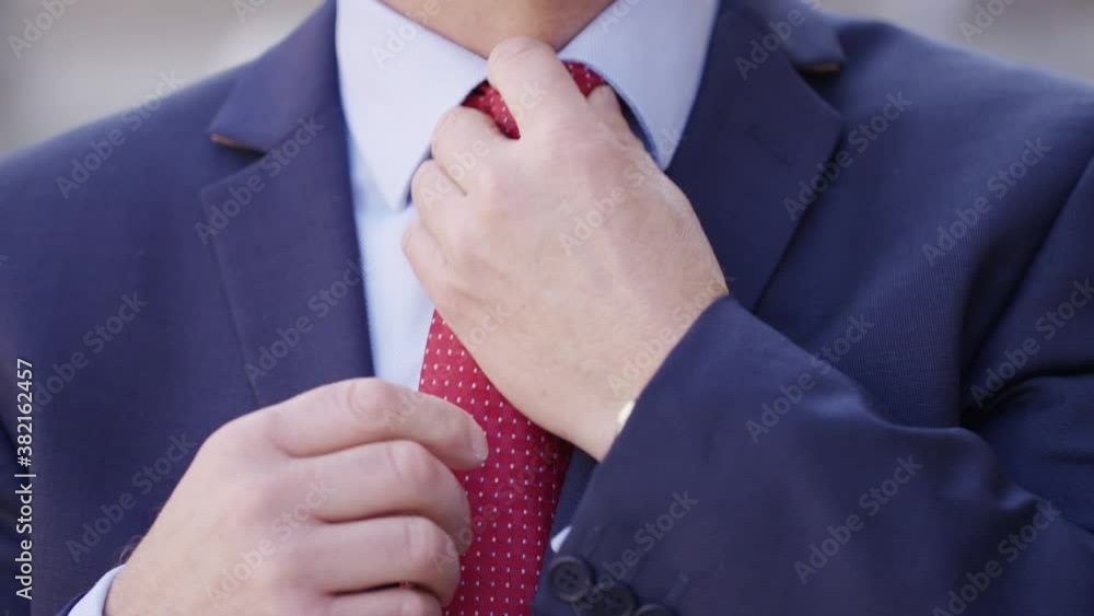 Close up of business man correcting his tie and suit Stock Video ...