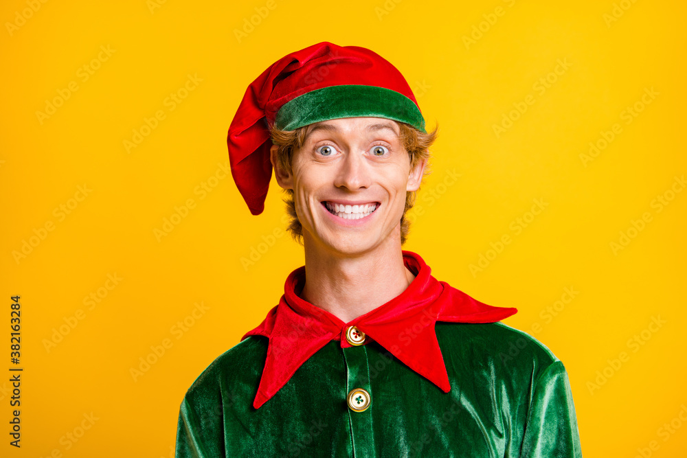 Close-up portrait of his he nice attractive cheerful cheery funny guy elf wearing festal clothes enjoying Eve Noel fairy isolated over bright vivid shine vibrant yellow color background Close-up portrait of his he nice attractive cheerful cheery funny guy elf wearing festal clothes enjoying Eve Noel fairy isolated over bright vivid shine vibrant yellow color background