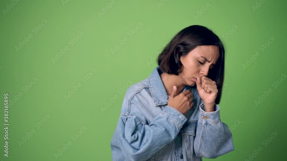 woman is suffering with cough and feeling bad on green screen chroma key background woman is suffering with cough and feeling bad on green screen chroma key background