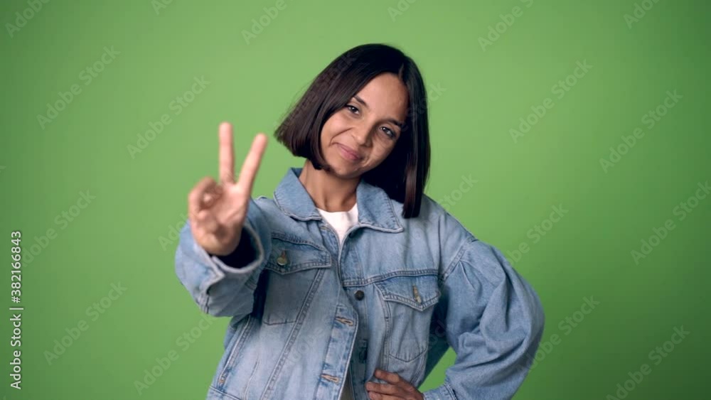 woman happy and counting with fingers on green screen chroma key background woman happy and counting with fingers on green screen chroma key background