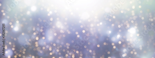 Golden bokeh background with blurry blue lights. Holiday festive background. Christmas, winter and new year banner