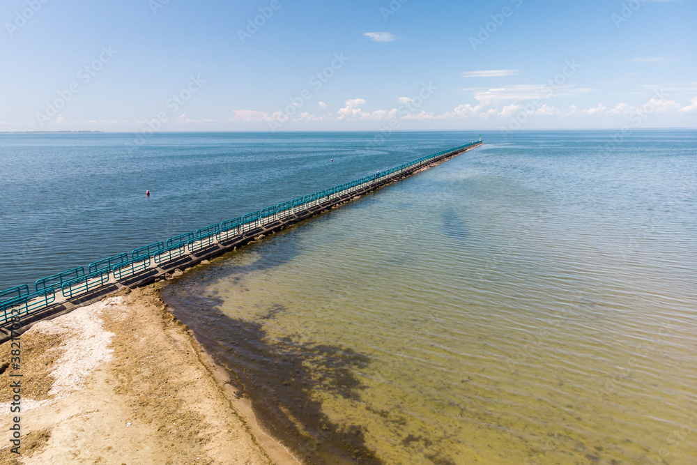 Drone shot of pier on Lake Huron on a summer day in Michigan
