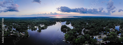 Panoramic aerial shot of sunset over lake in Michigan in summer