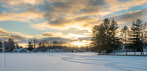 Winter sunset over small lake in Michigan © Brad
