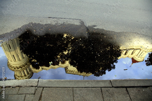 St. Nicholas Orthodox Church reflection in the water puddle after the rain, Vilnius, Lithuania photo