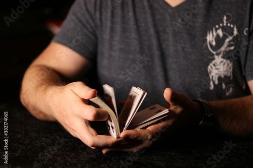 card magician pracard magician practicing sleight of hand magic Cardestrycticing sleight of hand magic