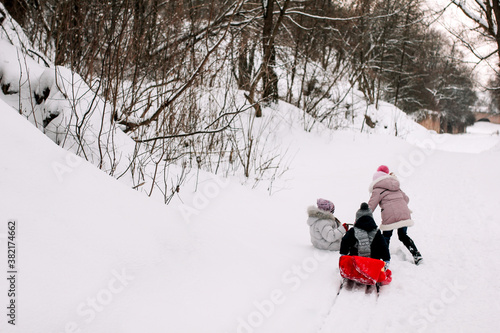 Kids walking in winter park