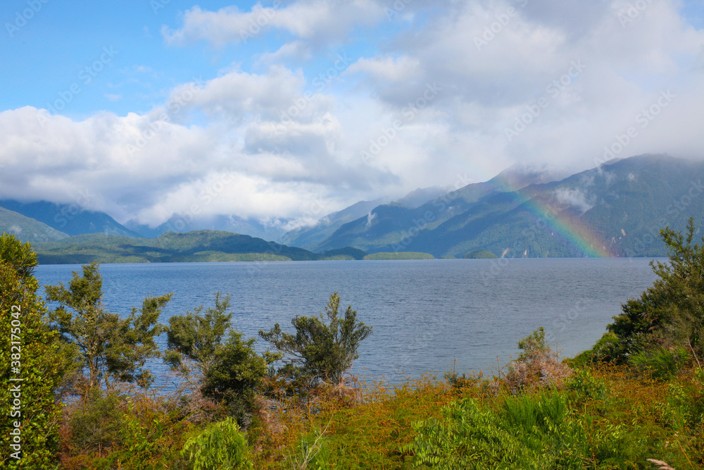 Wanaka lakefront with rainbow and mountains, Central Otago, New Zealand