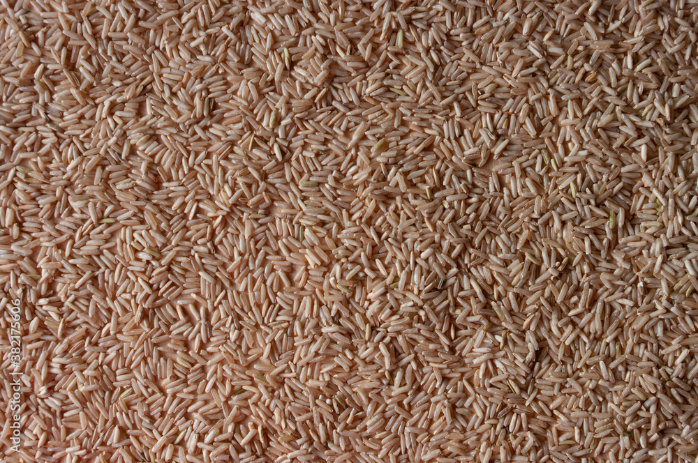 a brown rice background texture on plywood a brown rice background texture on plywood
